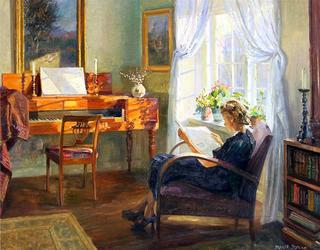 Sunny interior with reading woman