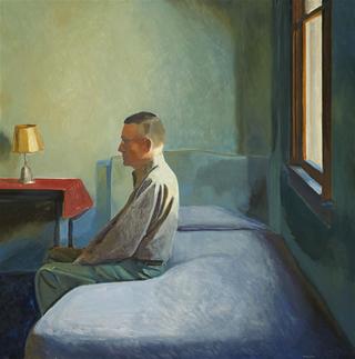 Man sitting on bed