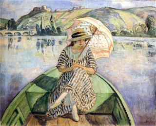 Woman in a boat with an umbrella