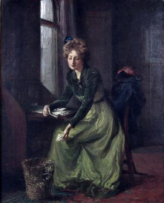 Girl in green dress sitting at a bureau