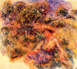 Woman in Blue with a Hat Sitting on the Lawn