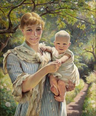 Woman with child in a flowering garden