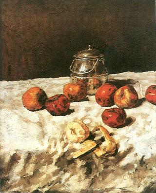 Apples on white with tin box, knife and peeled apple