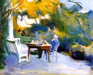 Alfred Lys Baldry seated at a Table in the Gardens at The Kennels