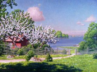 Cottage by the water with fruit trees