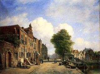A View in a Town with Townsfolk on a Street along a Canal