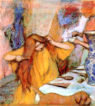 Woman in a Yellow Robe Combing Her Hair