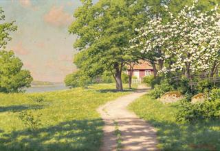 Cottage with flowering fruit trees