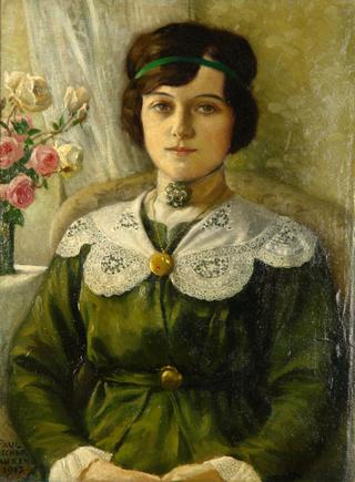 Portrait of a young woman in a green dress