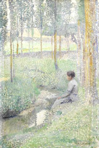 Woman sitting on the Edge of a Creek
