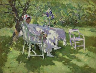 Woman in White Sitting in the Garden