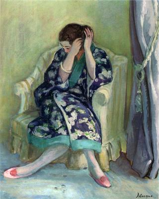 Woman Adjusting Her Hair seated on an Armchair