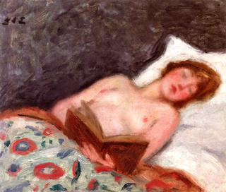 Young Woman Reading in Bed