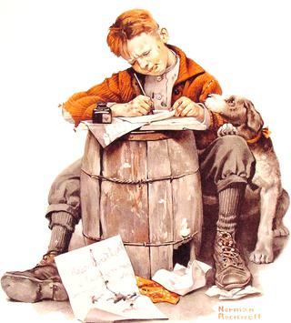 Little boy writing a letter