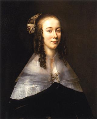 Portrait of a lady wearing a black dress and a white collar