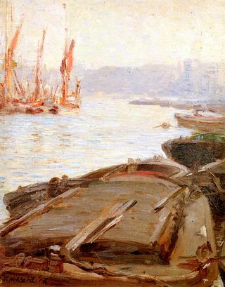 View of Barges and Sailboats in a Harbor