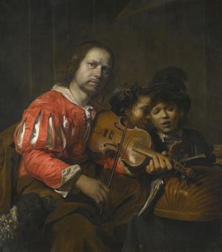 A violin player accompanying two young singers