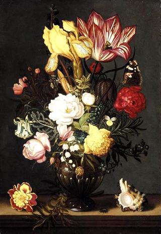 Flowers in a decorative vase, flanked by a shell and marigold, on a stone plinth