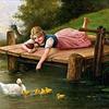 池塘边喂鸭子的女孩